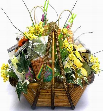 Basket of Honey peanuts, Lemon Candies, Lime Candies, and flower fillers.