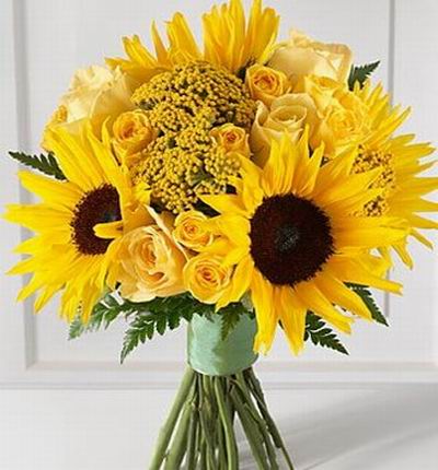 4 Sunflowers, 11 yellow roses with Yarrow / Achillea fillers (based on availability it may be replaced with other yellow fillers such as Solidago, Pompon)