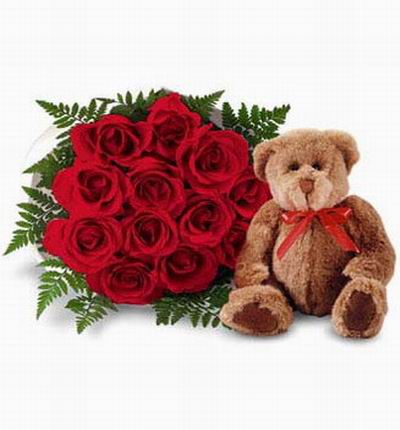 12 roses with a 20cm teddy bear. Teddy bears may vary based on availability.